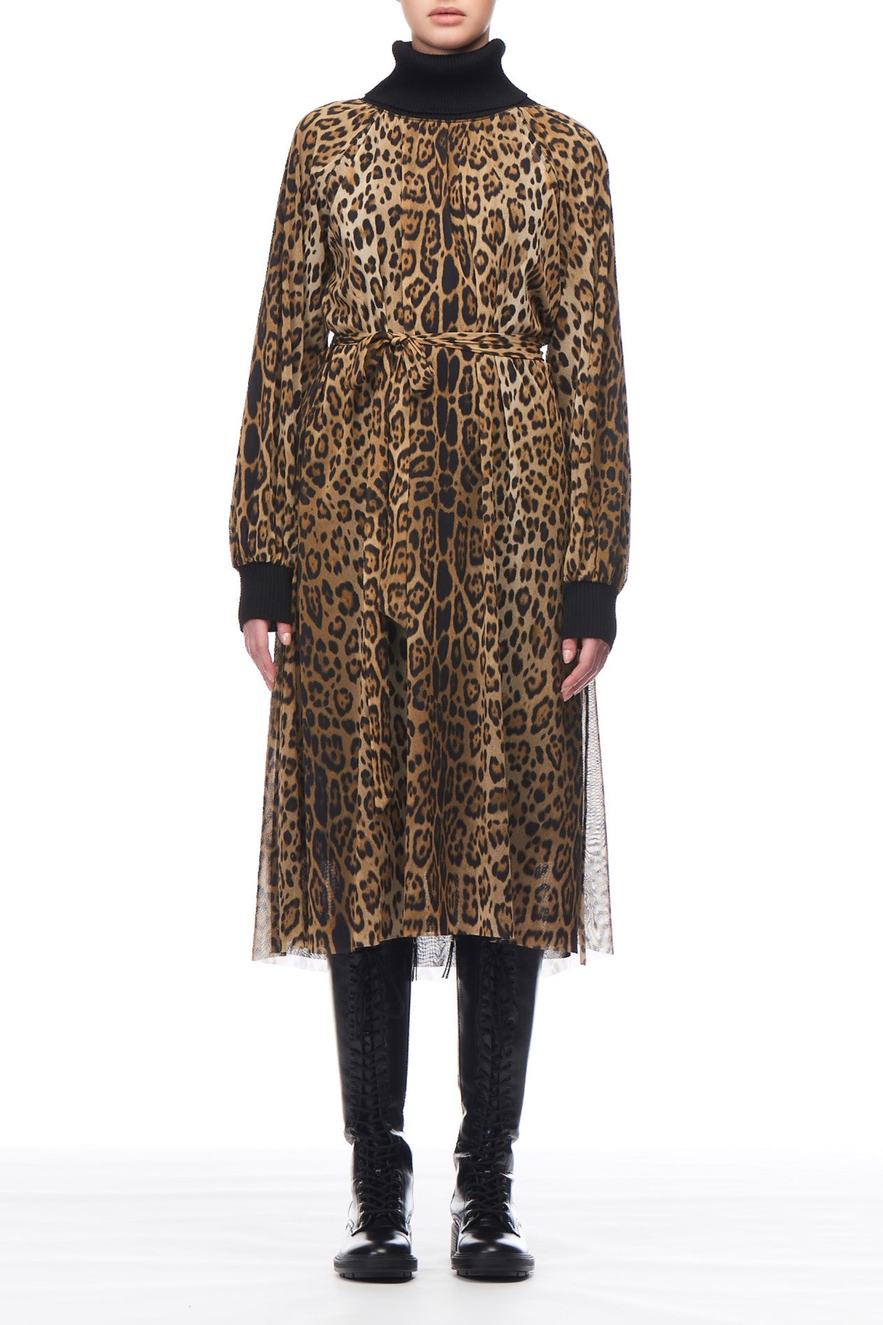 A person radiates ethereal elegance in the Fuzzi Woman Leopard Dress with Belt, a long ensemble featuring a black turtleneck and long sleeves. Perfect for a special occasion, this outfit is completed with black boots, set against a plain white background.