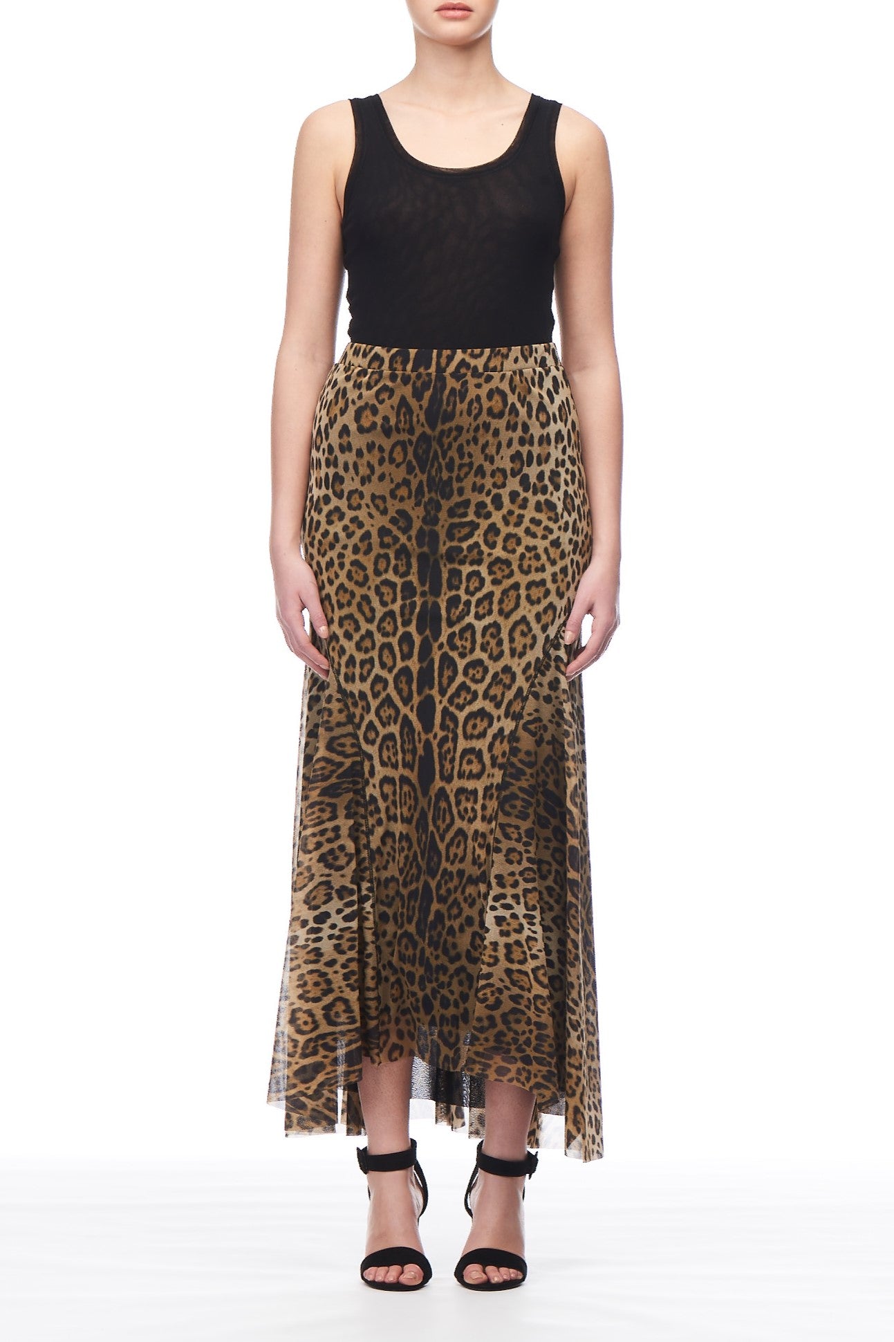 A person wearing a sleeveless black top and the Fuzzi Woman Leopard Print Mesh Midi Skirt stands against a white background, complemented by black high-heeled sandals.