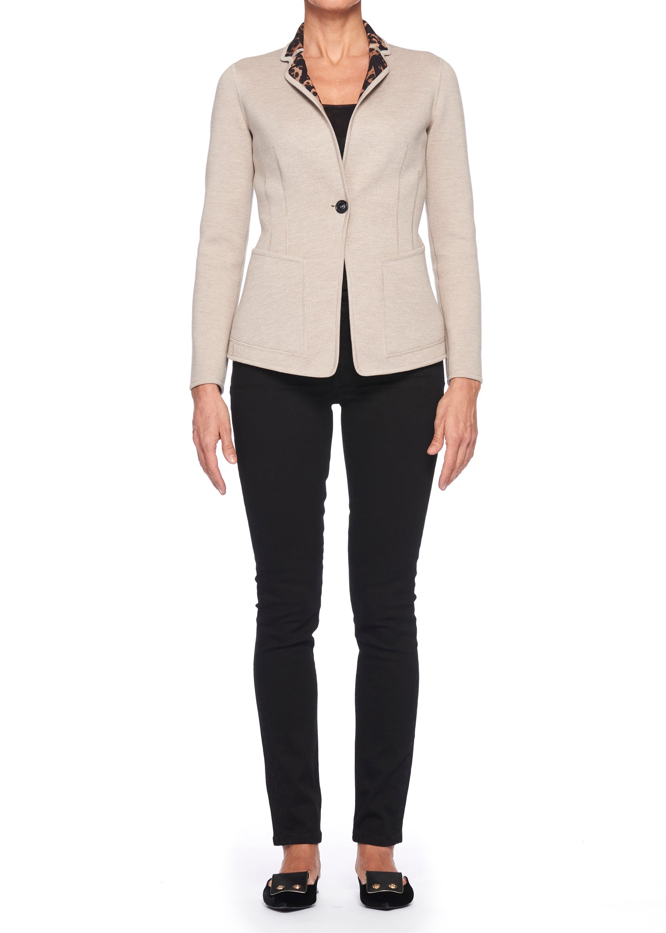 A person is dressed in the elegant Fuzzi Woman Jacquard Jacket with its vintage beige design and patterned collar, layered over a classic black top and paired with matching black pants and shoes. This timeless ensemble creates a stunning contrast against the crisp white background, making it an ideal choice for transitioning into fall and winter fashion.