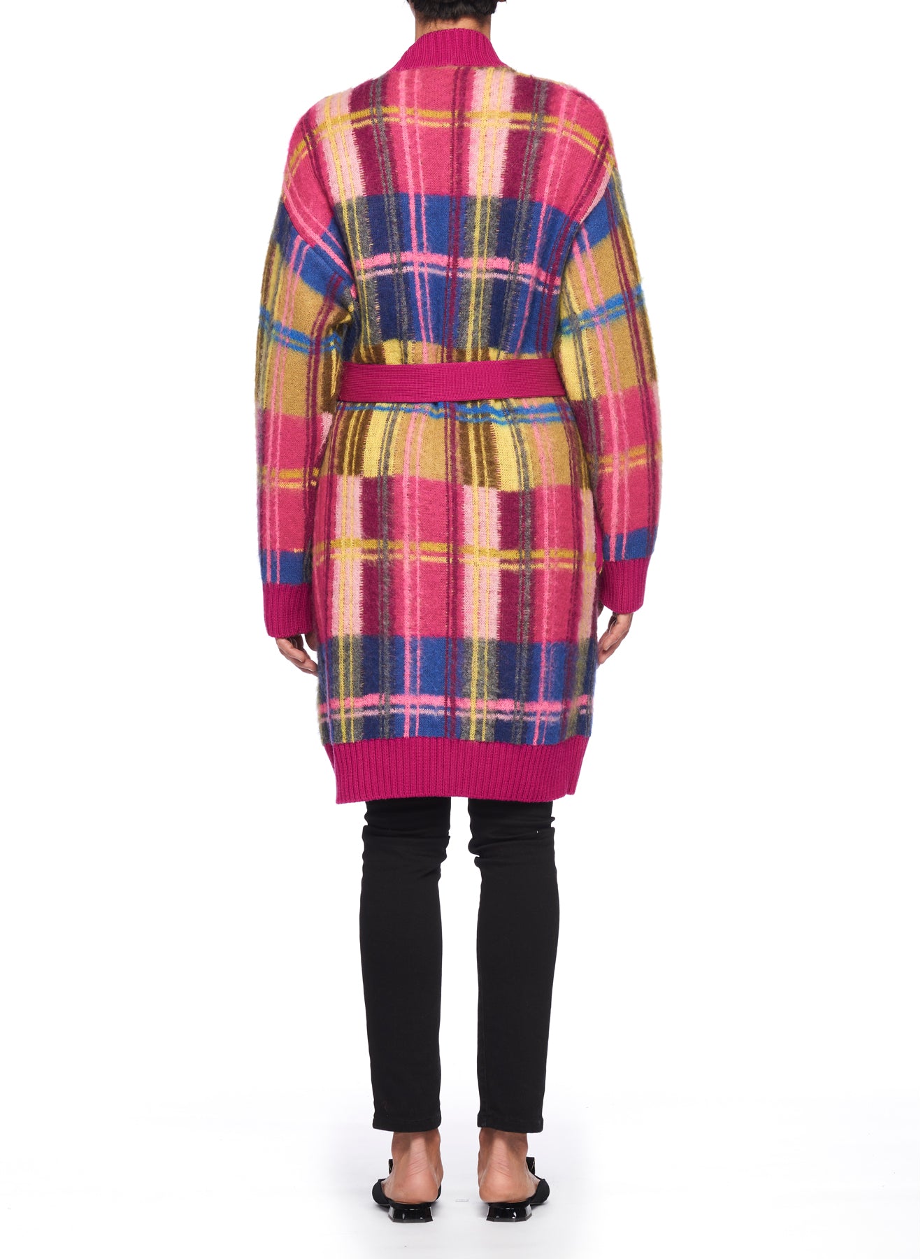 A person is seen from the back against a white background, dressed in a vibrant Fuzzi Woman Cardigan Coat featuring a colorful plaid pattern in shades of pink, yellow, and blue. The cardigan includes a belted waist, and is paired with black pants and sandals.