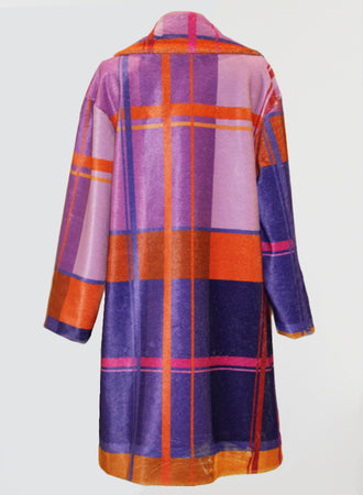 This vintage piece, the Fuzzi Woman Colorful Plaid Coat by Fuzzi, features a vibrant plaid pattern in shades of purple, pink, orange, and red. Large intersecting stripes and color blocks enhance its bold and stylish appearance. The coat is elegantly showcased from the back.