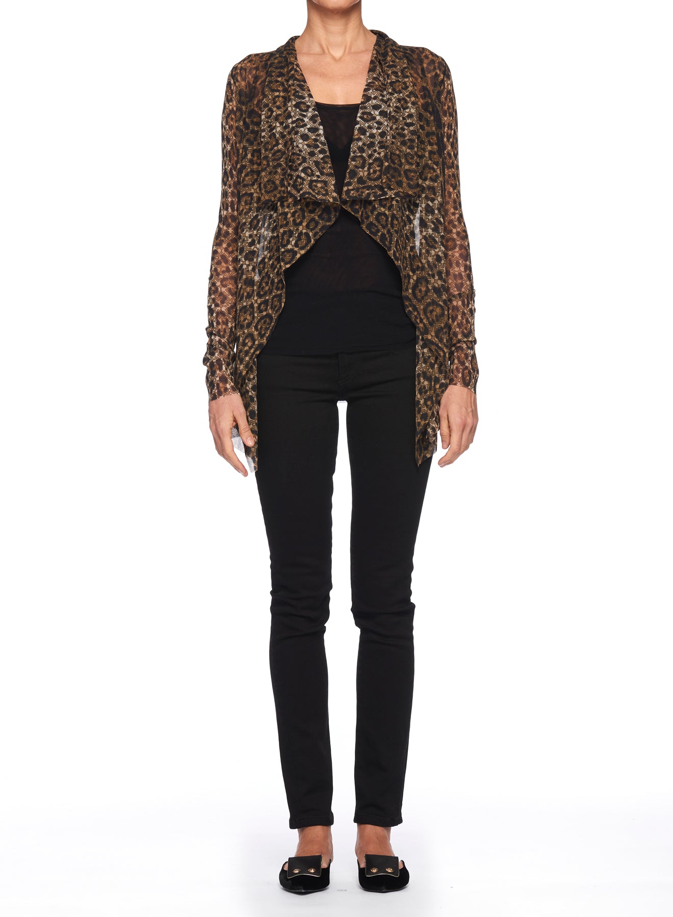 A person is wearing the Fuzzi Woman Leopard Print Mesh Cardigan by Fuzzi over a black top, paired with black pants and shoes. The sheer fabric of the cardigan adds elegance to the outfit. The photo shows a front view on a plain white background, highlighting its chic draped design.