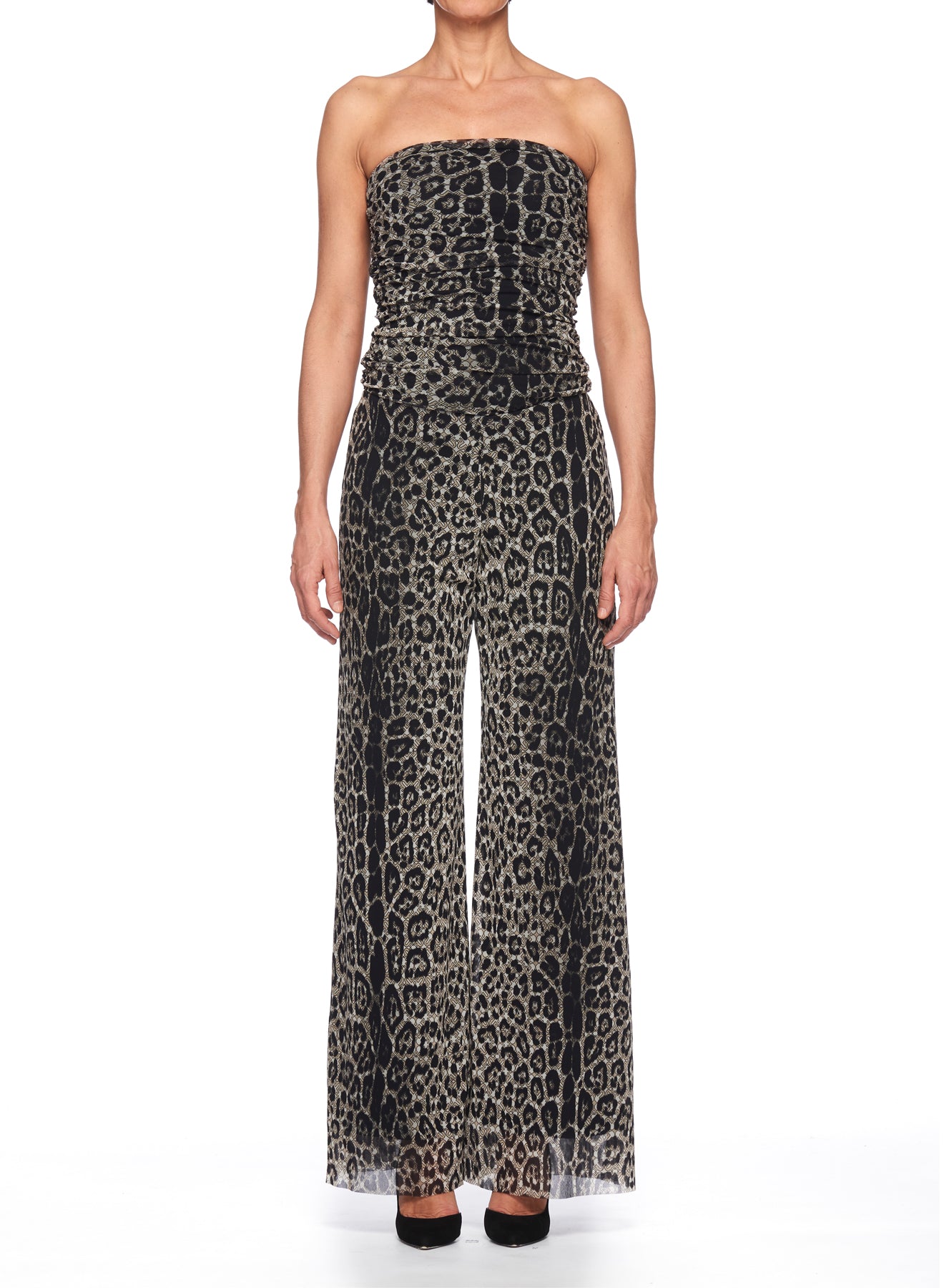 A person wearing the Fuzzi Woman Leopard Print Mesh Jumpsuit by Fuzzi stands against a white background. The outfit features a fitted bodice and wide-legged pants, highlighting the dynamic animal pattern in black and beige tones.